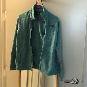Turquoise Patagonia fleece. Beautiful and comfy. Just switching styles.